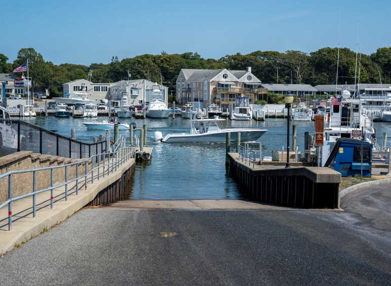 Marina boat launch ramp with docked boats
